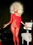 Making a Madonna-like pose in a barely-there red lace ensemble at a performance in Sept.